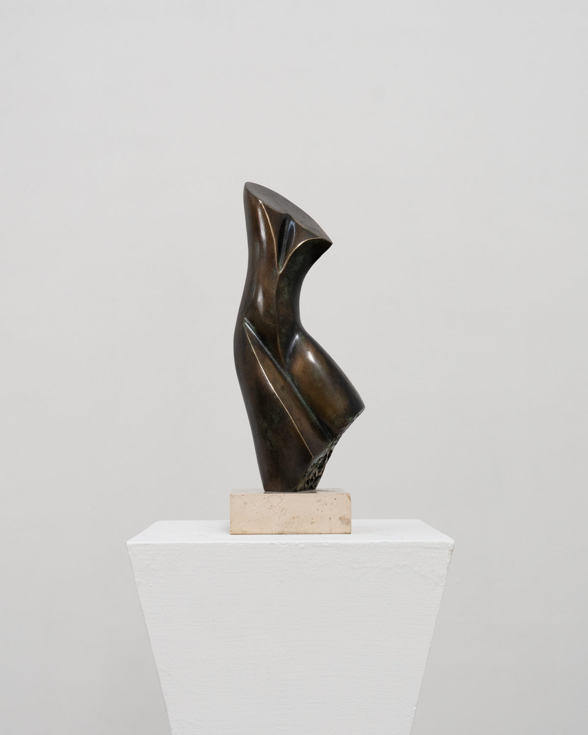 Abstract bronze sculpture with curved flowing forms by Stanislaw Wysocki