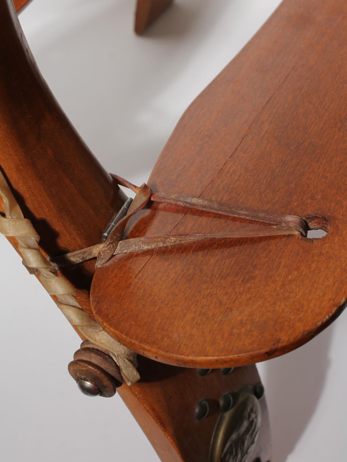 Egyptian Ottoman Camel Saddle Stool — close-up of wooden seat with leather ties
