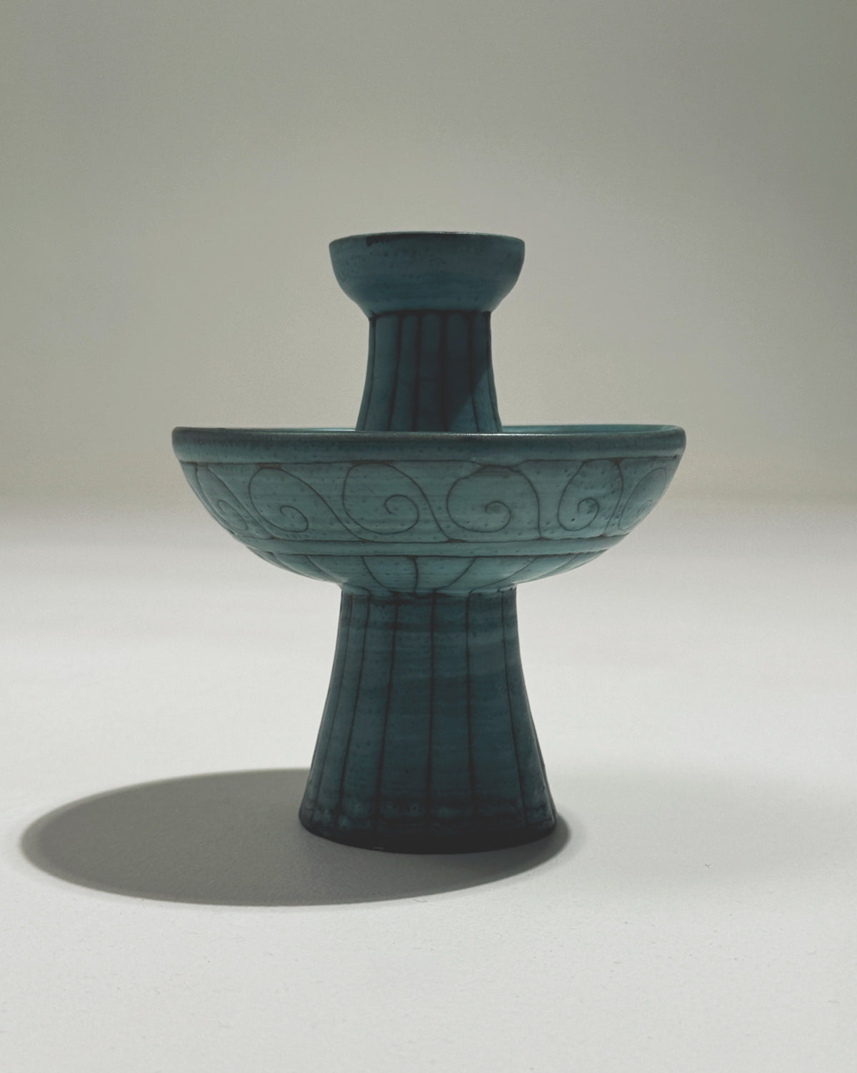 Turquoise ceramic candlestick holder with spiral motifs by Jacques Sagan