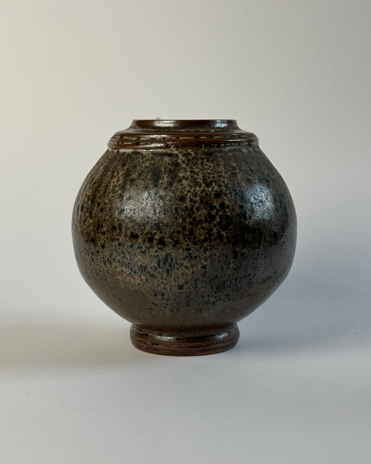 French Art Deco stoneware vase with speckled dark glaze, 1930
