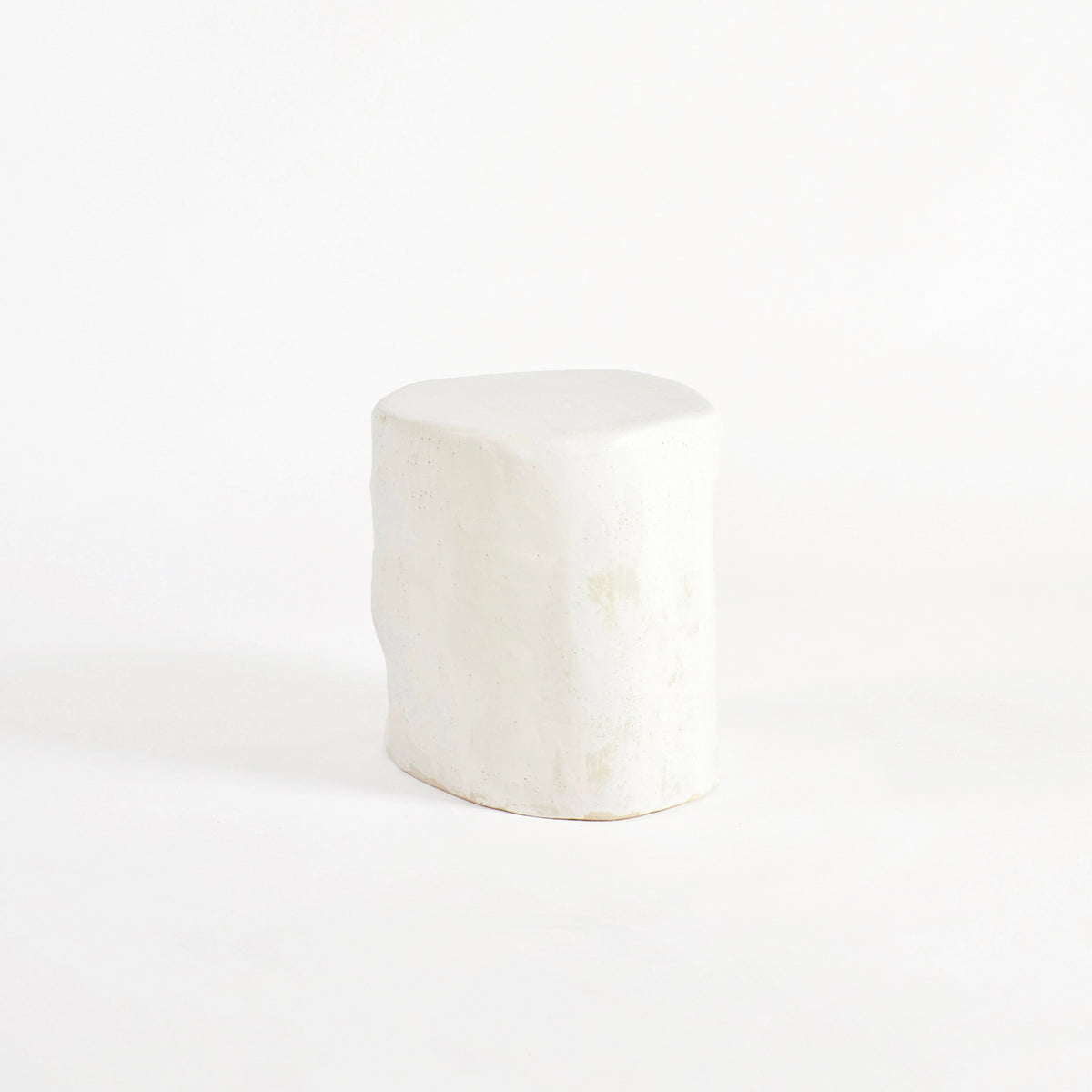Ceramic Side Table (small) — side angle showing textured white surface