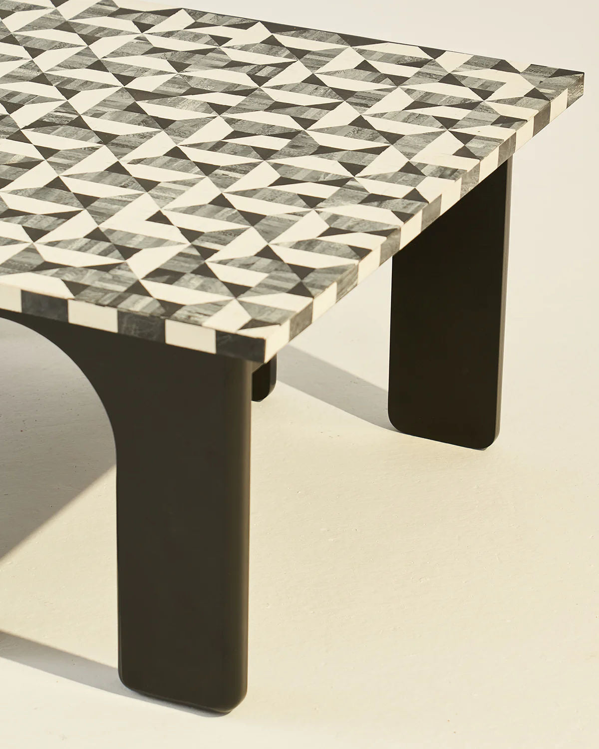 Leo Coffee Table — angled view of patterned tabletop and black legs