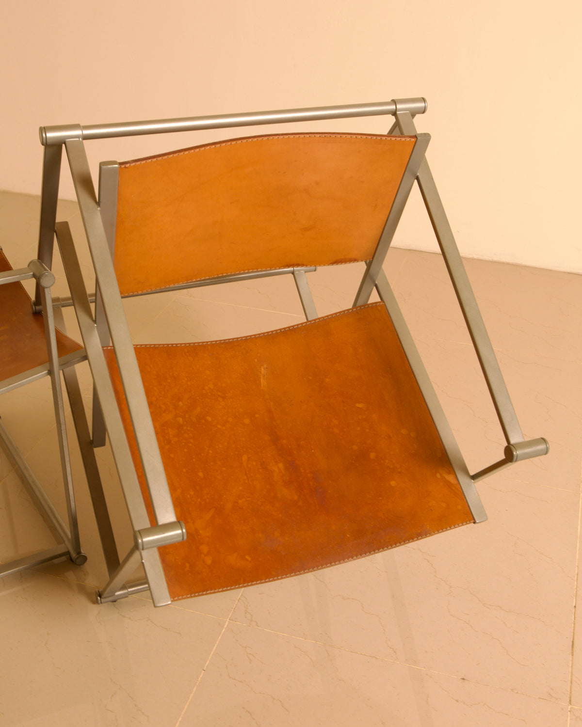 Pair of "FM62" Armchairs by Radboud van Beekum for Pastoe, 1980s — angled view showing leather seat and metal frame