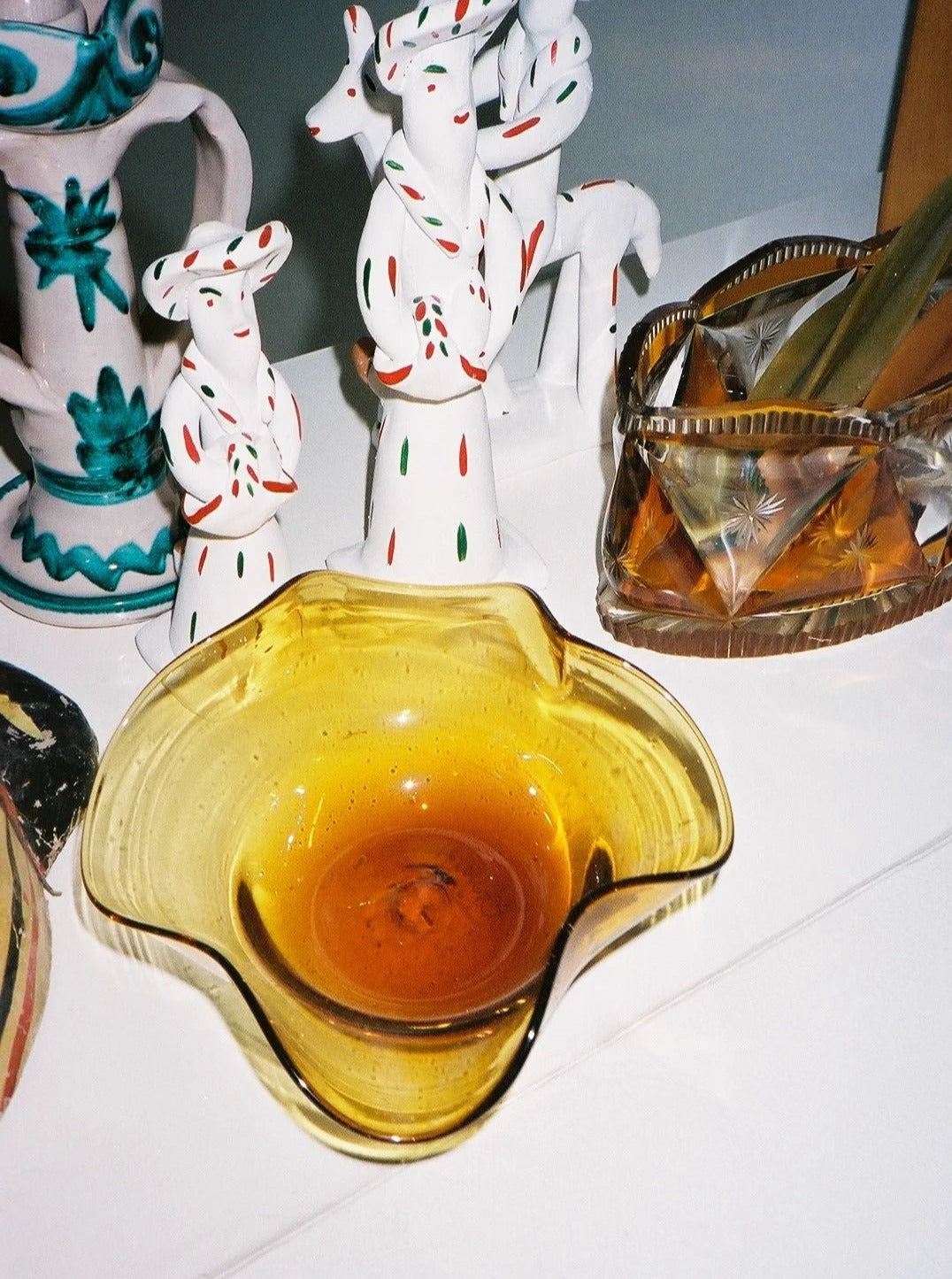 Michele Bowl Small — amber glass bowl on white display surface