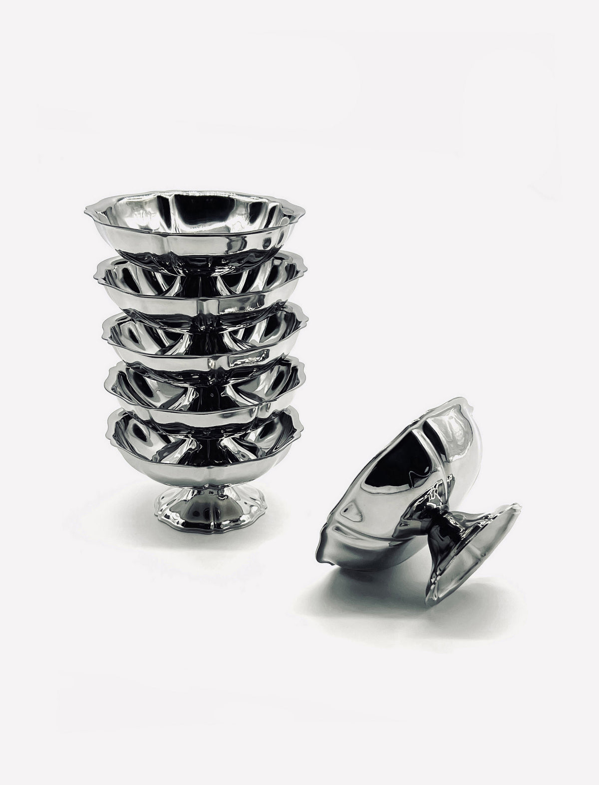 Set of six vintage stainless steel ice cream coupes stacked together