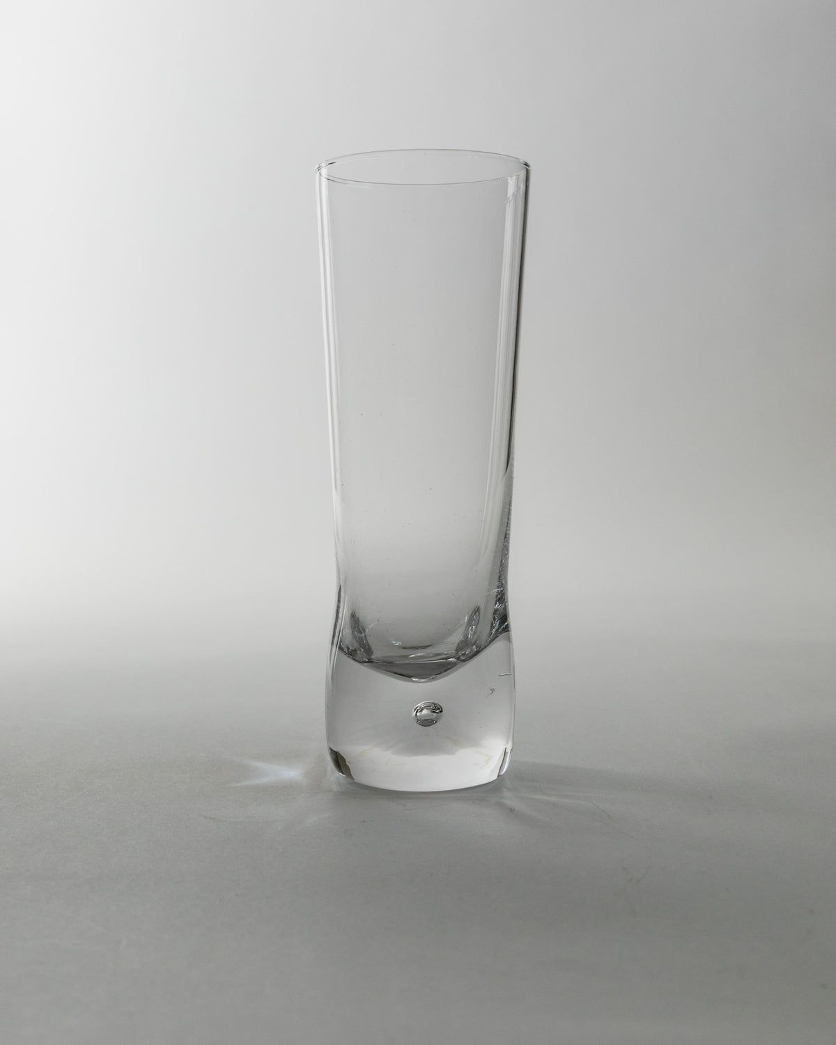 Set of 6 Vintage Murano Glasses, Italy 70s — front view of clear glass in studio setting