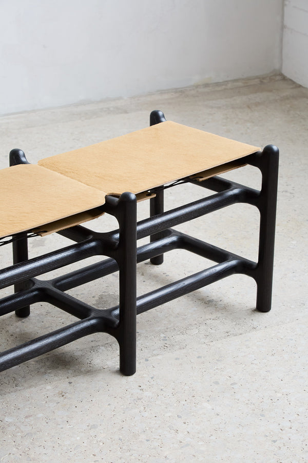 Lyndoe Bench in Solid Wood and Leather — angled view showing black frame and leather seat