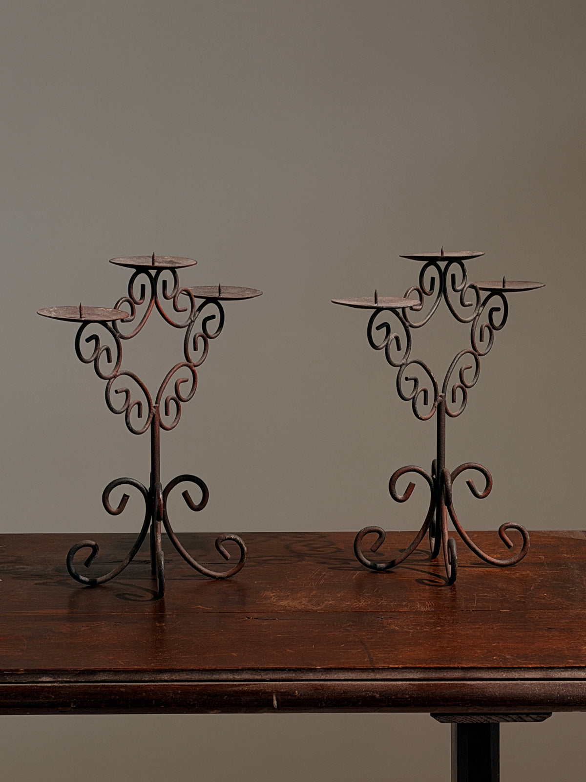 Pair of three-light wrought-iron candleholders, circa 1950 — close-up