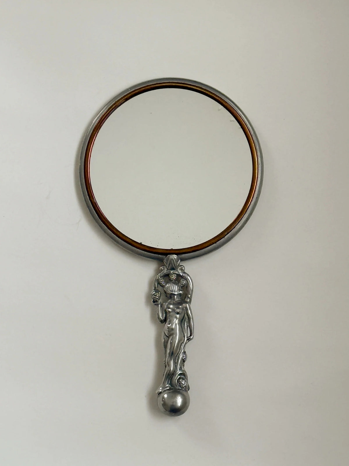 CG Hallberg Hand Mirror in Pewter, Swedish Grace, 1933 — top view of round mirror with pewter handle