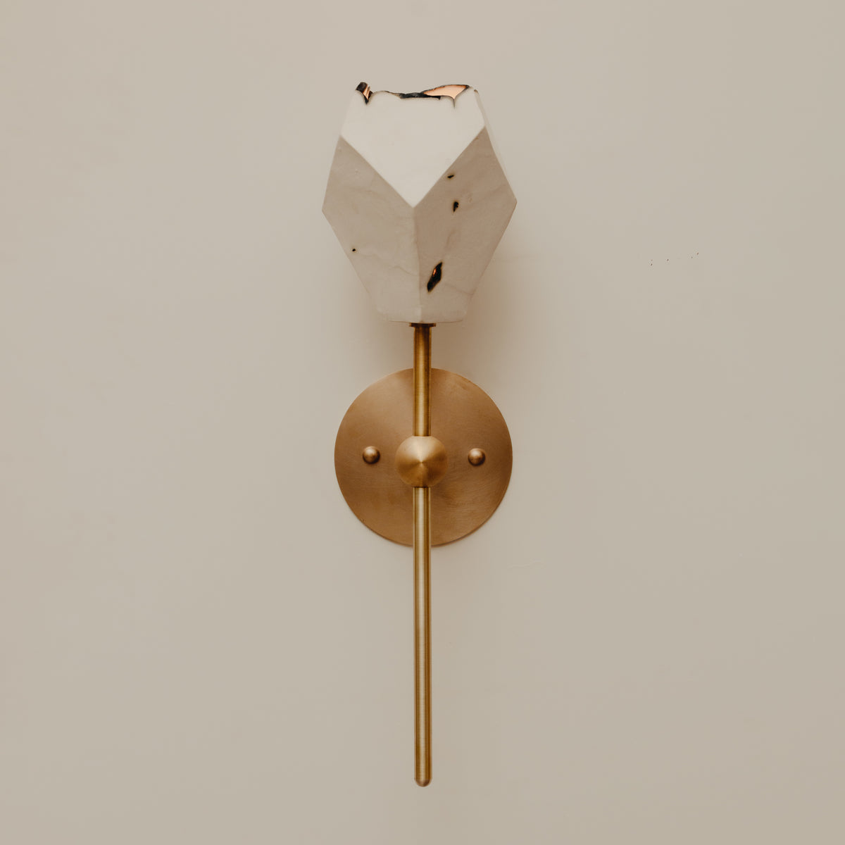 Relic Torch Sconce — close-up of white marble and brass details