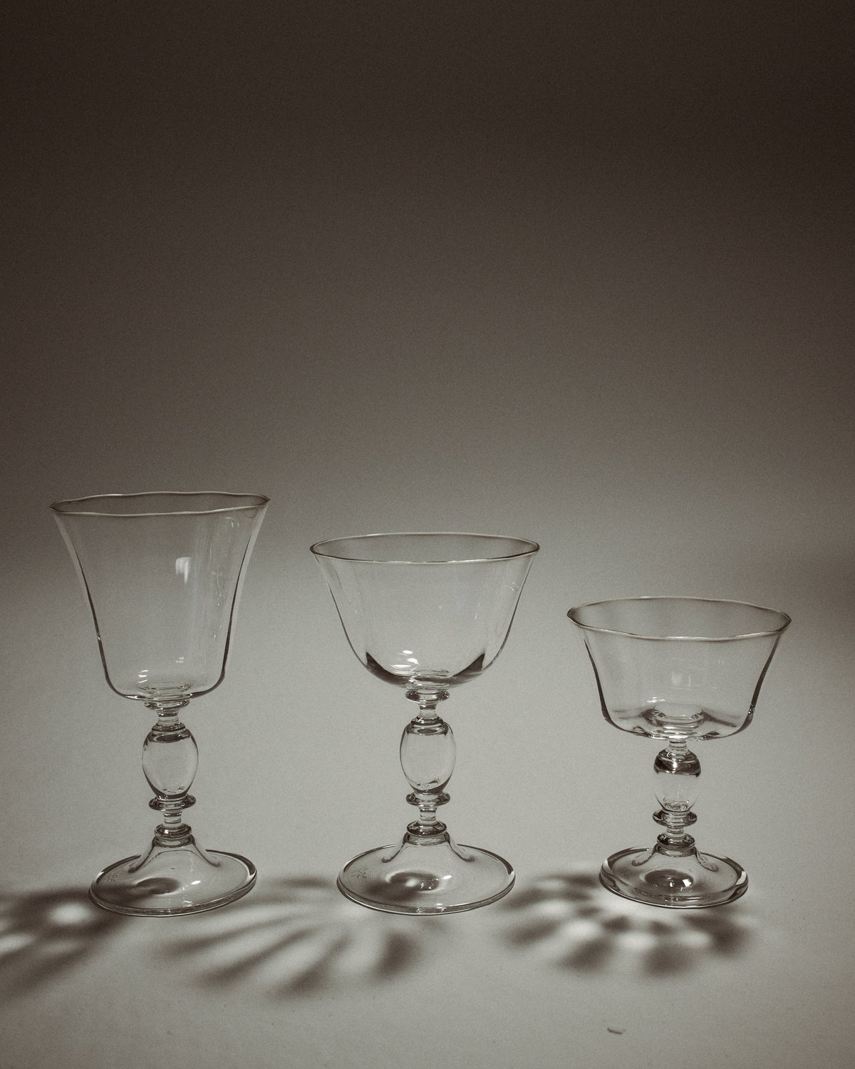 Alban Wine Glass - Set of Four — three glass sizes on neutral background