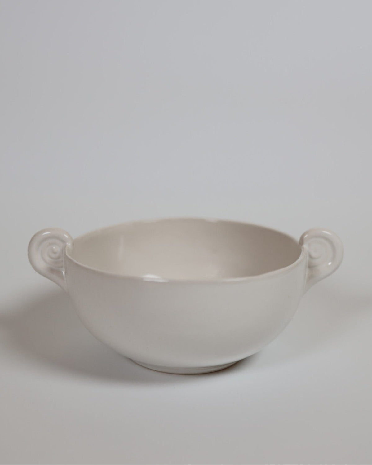 White ceramic Aries bowl with sculptural horn handles