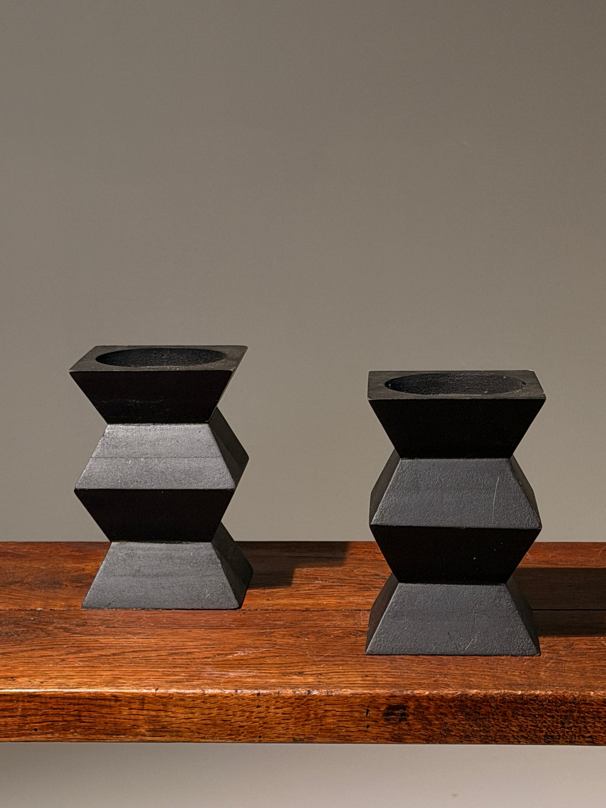 Pair of geometric black wooden candlesticks, anonymous work by Figuresdesign | The Oblist