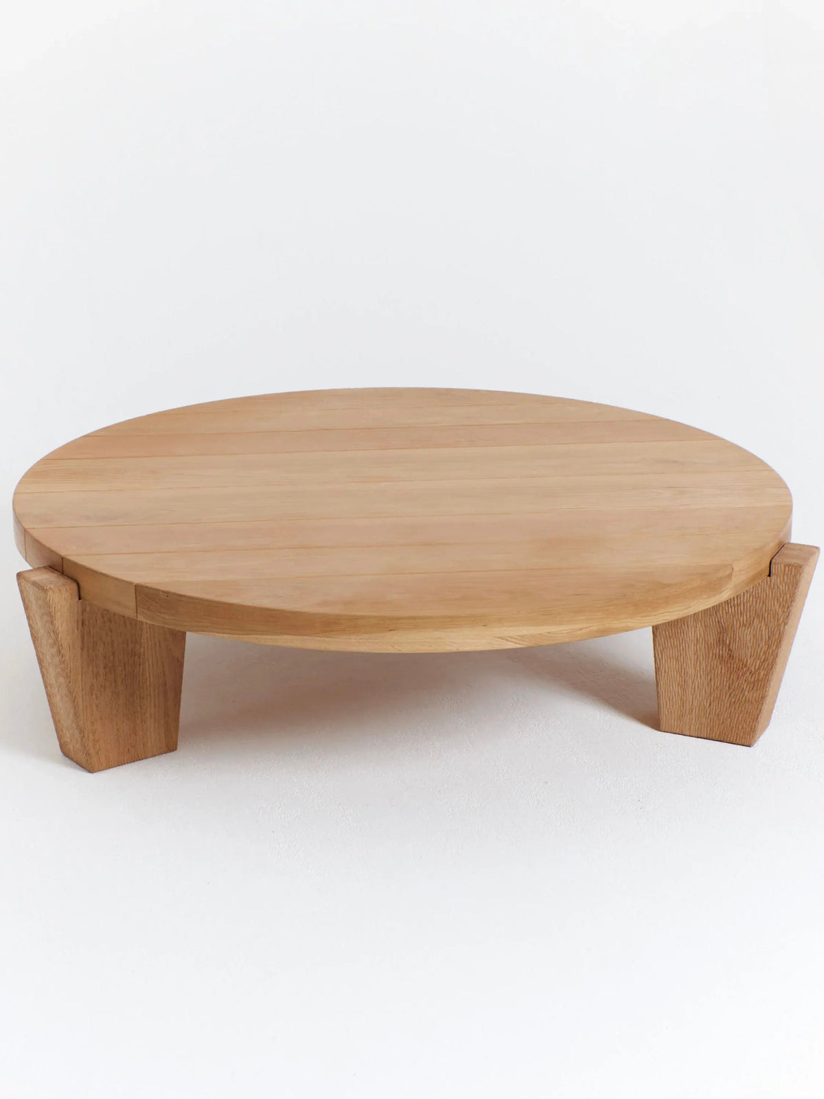 Peniche Coffee Table in Oak — front view with rounded top and wooden legs