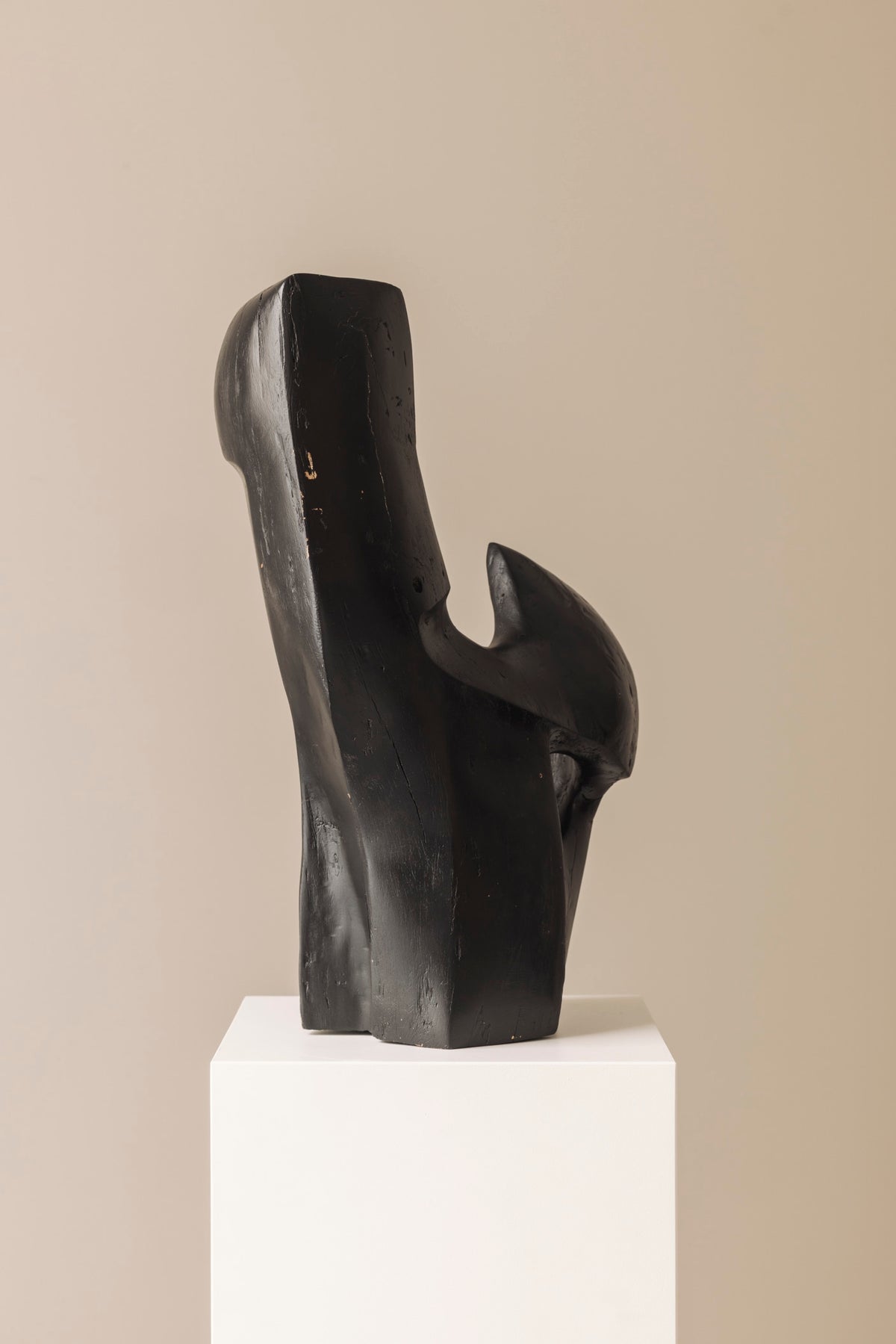 Abstract sculpture in solid dark stained wood dating from the 1950s. — close-up