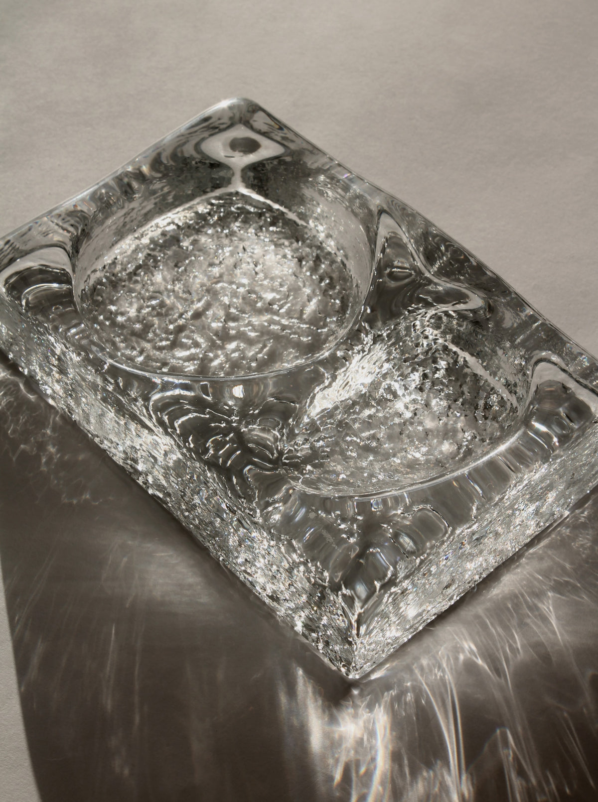 Kosta Boda glass ashtray detail showing textured bubble interior