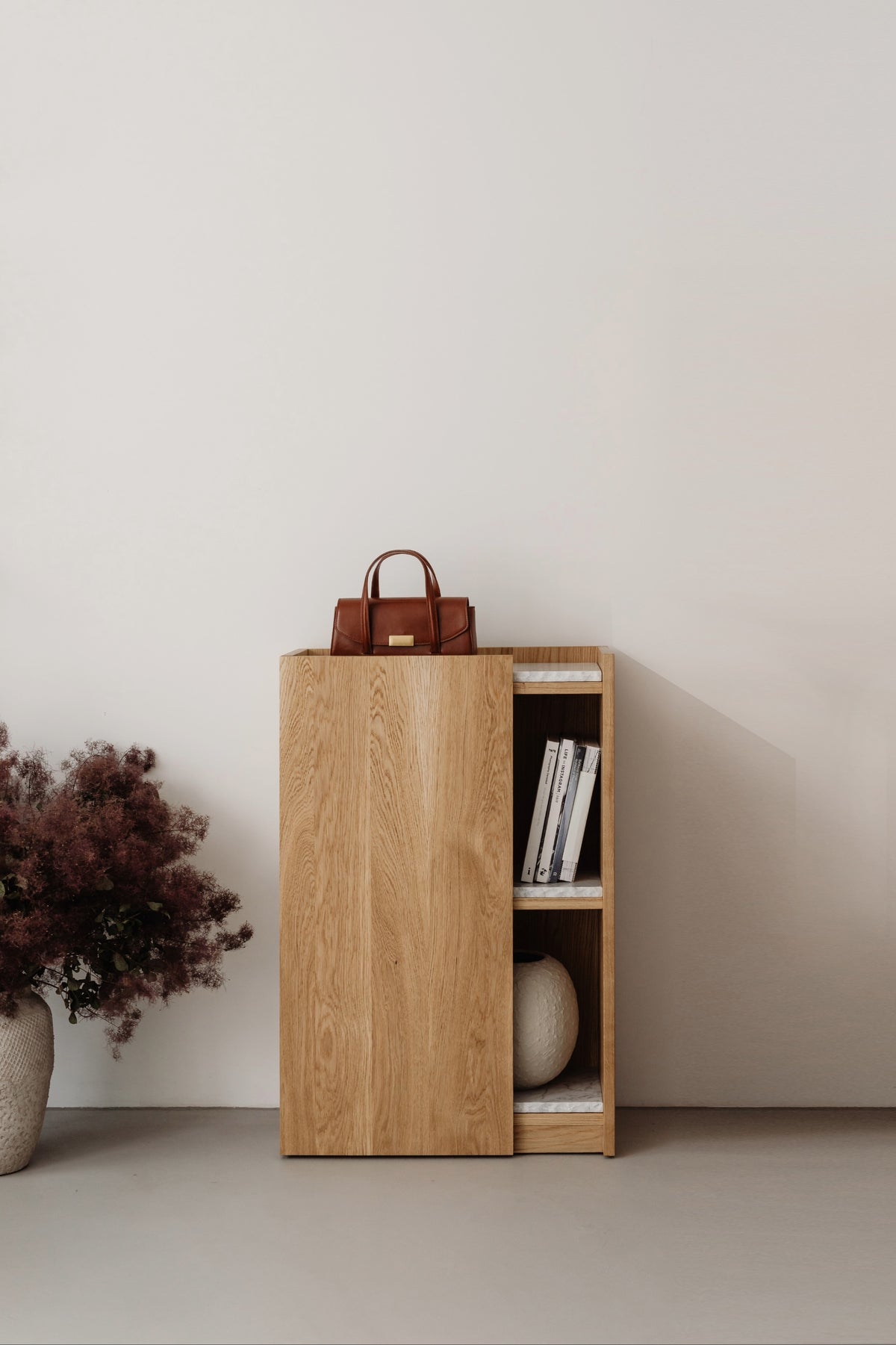 PAVO oak cabinet with sliding door and open shelving display