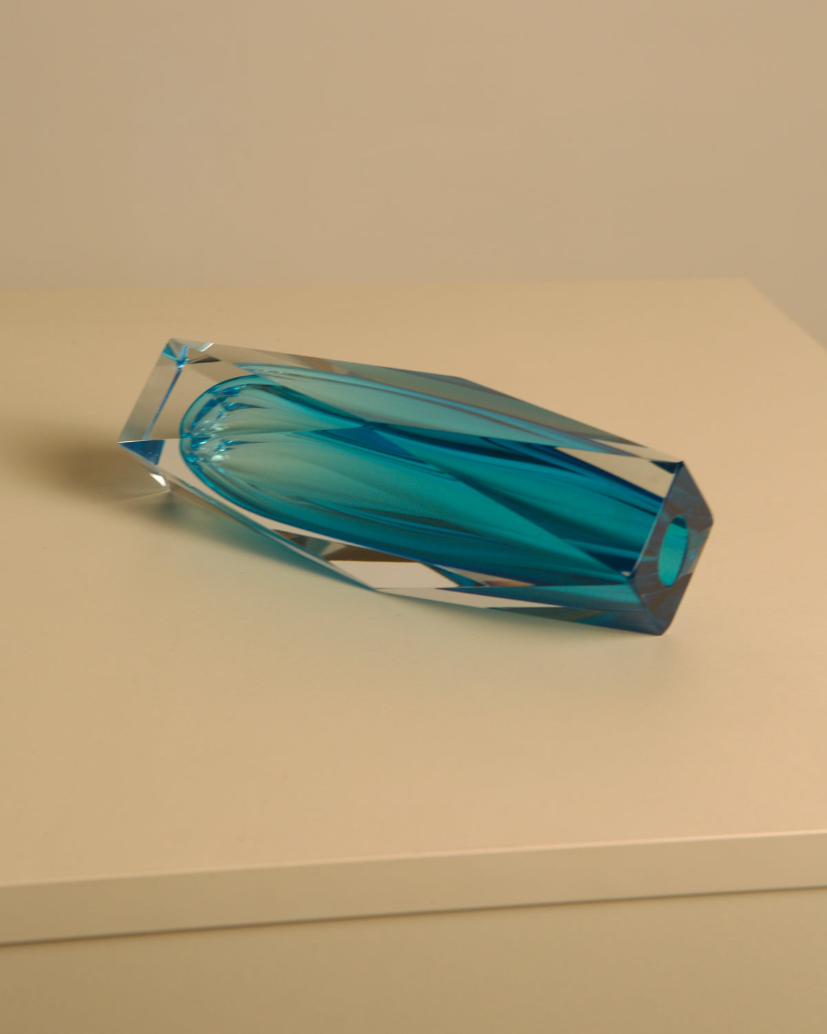 Turquoise Diamant vase by Flavio Poli profile view on beige surface