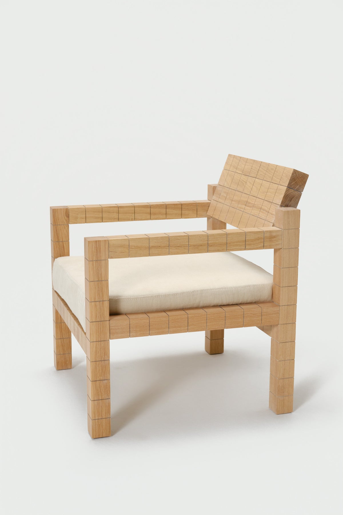 Mosaico Armchair — angled view highlighting natural wood texture