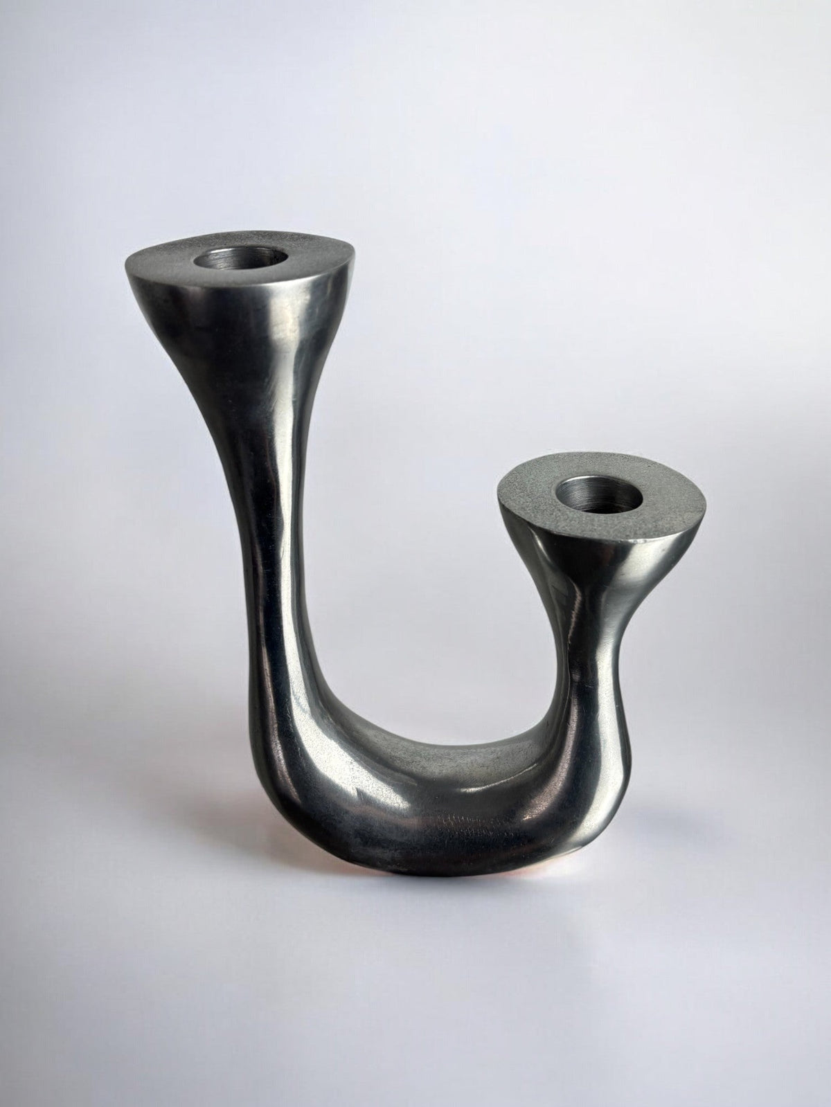 Biomorphic Candleholder, Aluminum, Spain, Circa 1970s — close-up of smooth metallic surface