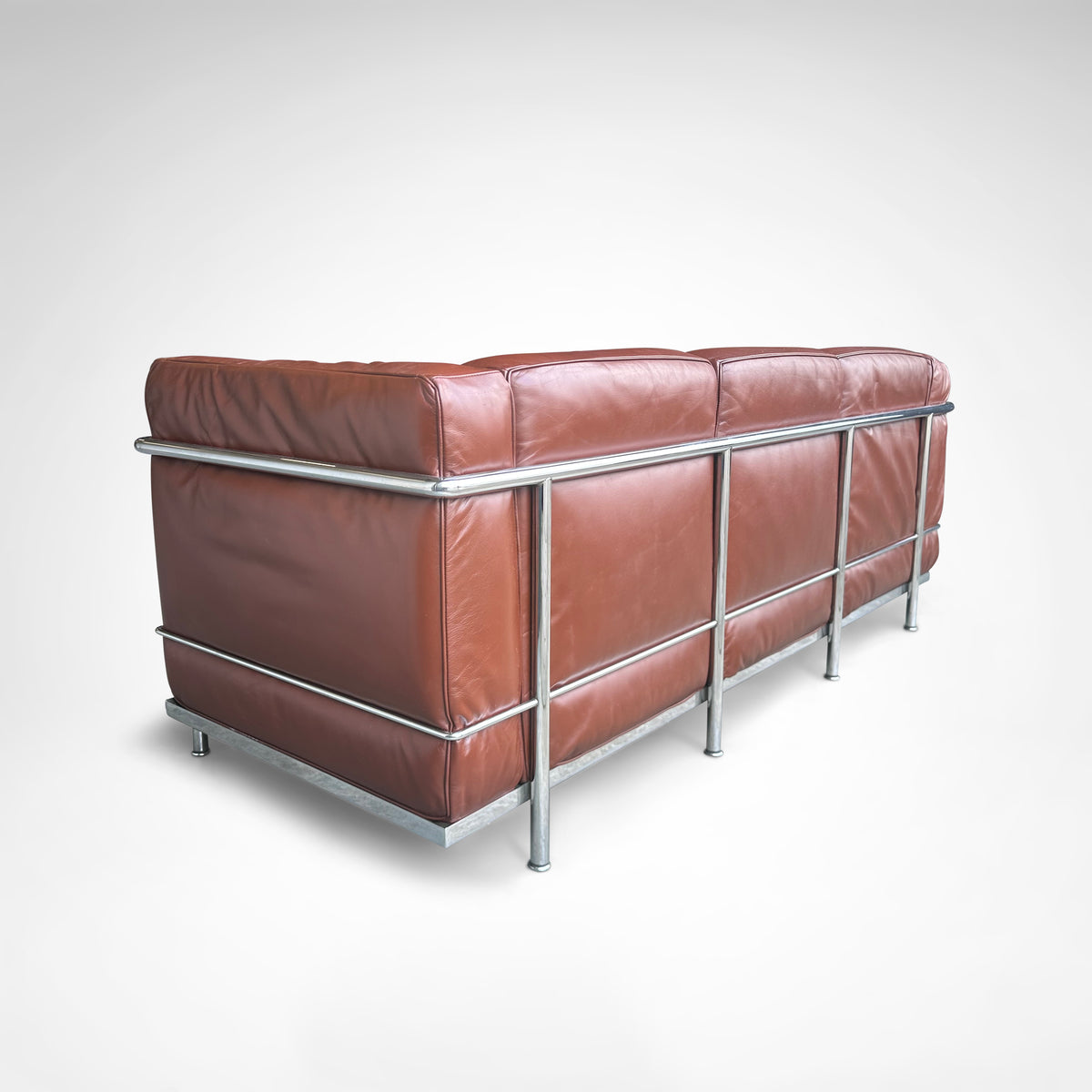Early production LC2 leather 3-seater sofa by Le Corbusier et al Cassina 1970s — rear angle showing brown leather and chrome