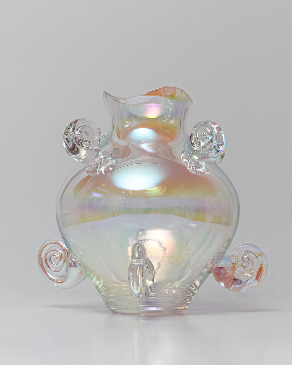 Iridescent crystal vase with spiral handles and rainbow finish