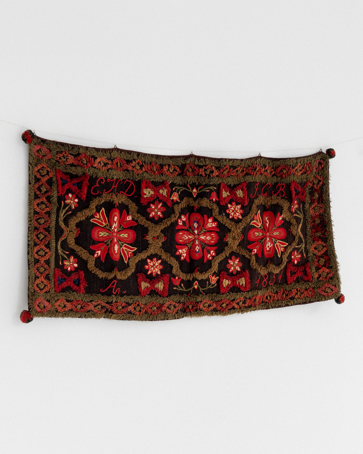 Ornate floral embroidery detail of antique Swedish wedding tapestry