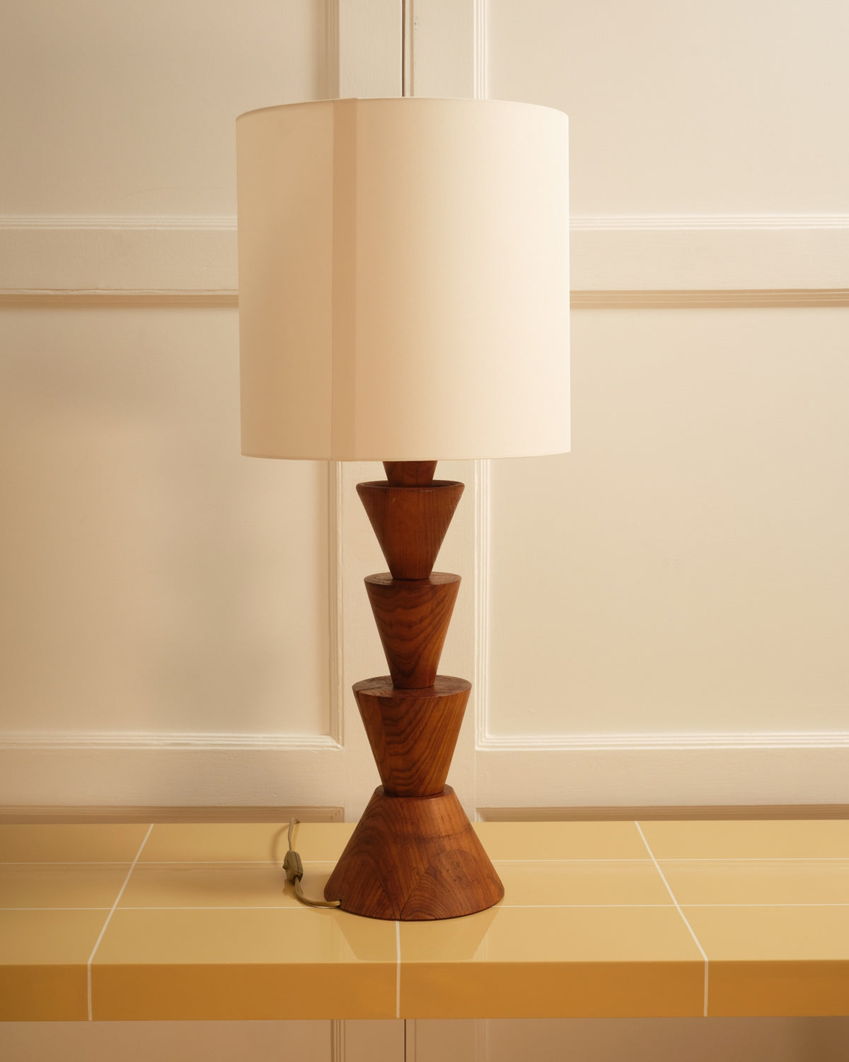 Mid-century wooden table lamp with stacked geometric base design