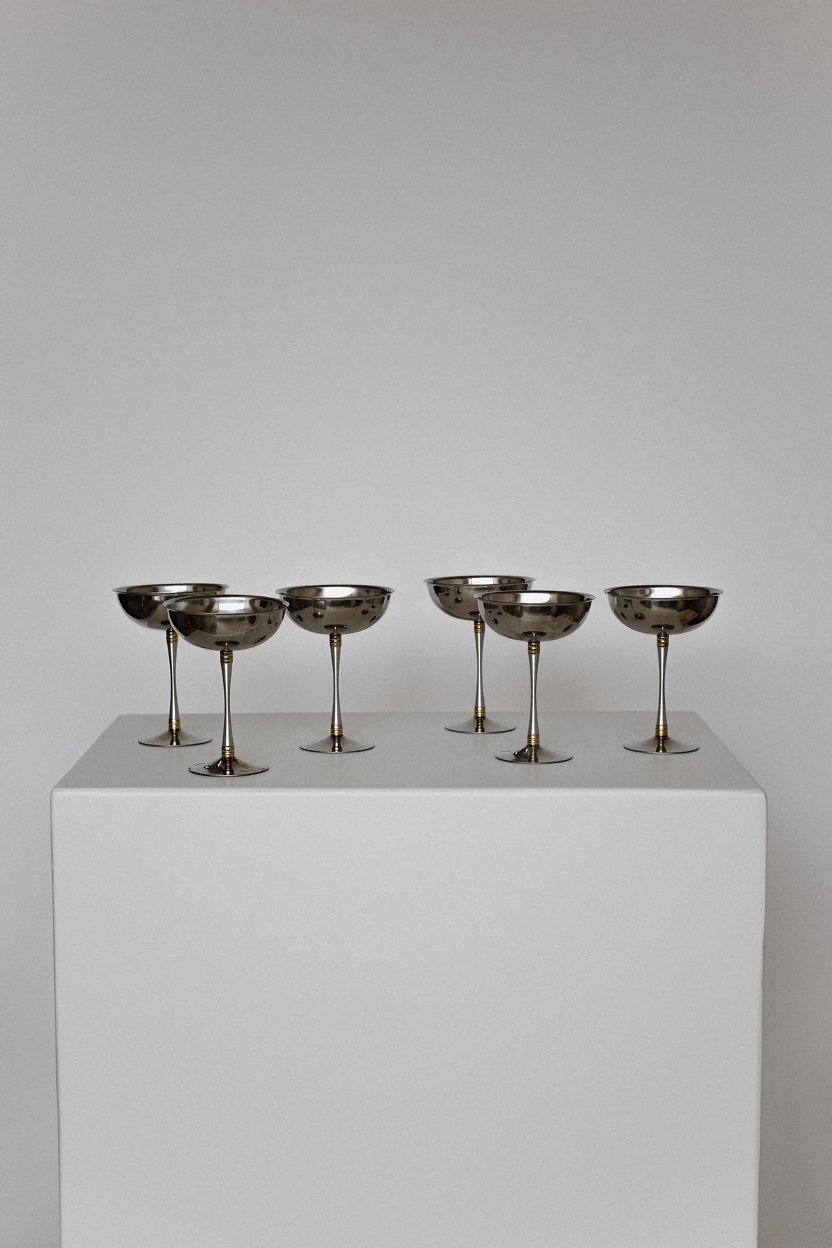 Set of 6 Large Ice Coupes — arranged on white pedestal with neutral background