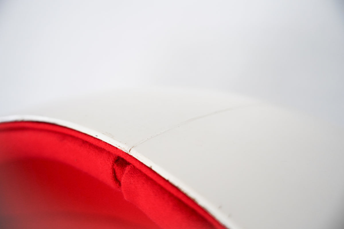 Red interior detail of Ball chair by Eero Aarnio showing curved form