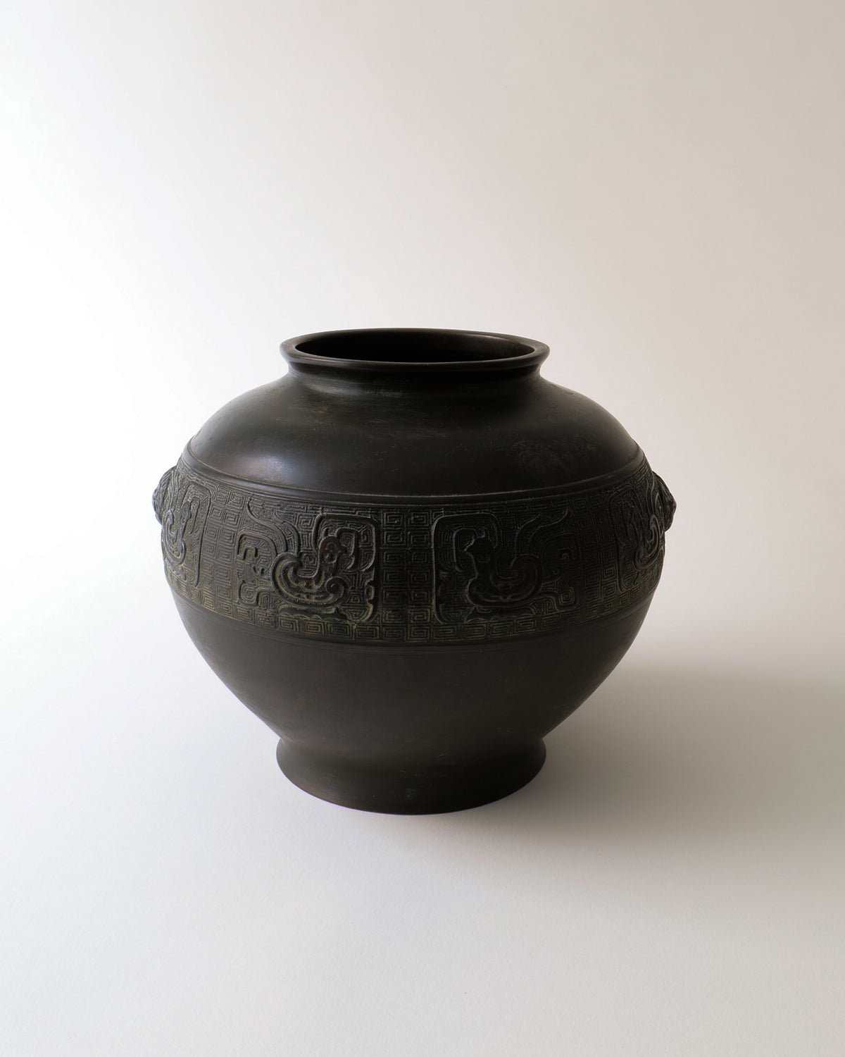Dark bronze ikebana vase with carved relief band, Japan 1900s