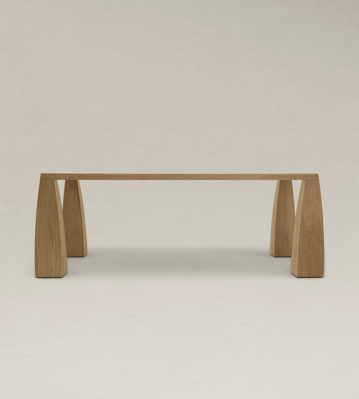 Khram Dining Table — front view highlighting wooden legs and tabletop