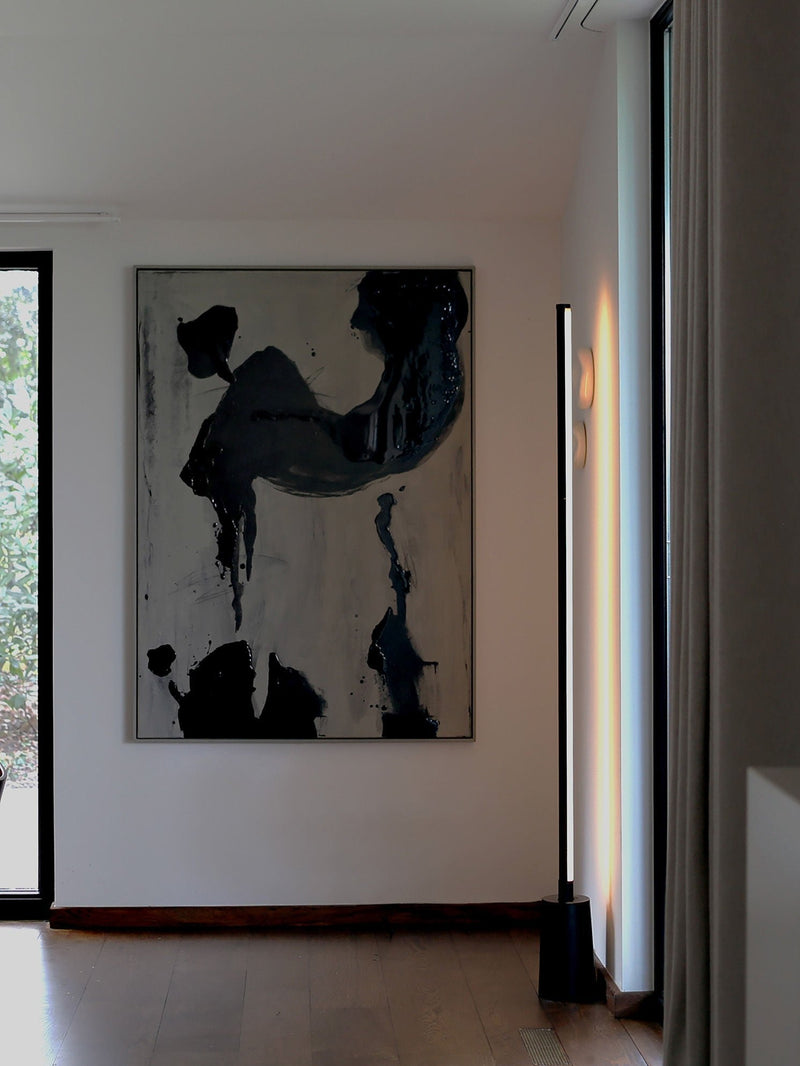 Abstract black brushstroke painting on white canvas by STUDIOPOLS