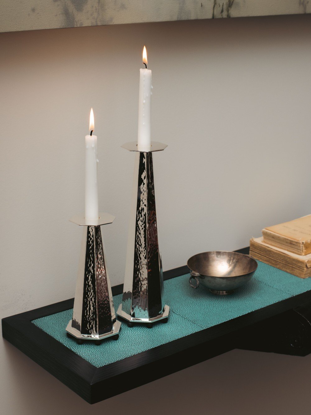 Silver Plated Tall Candleholder — side view on textured teal surface