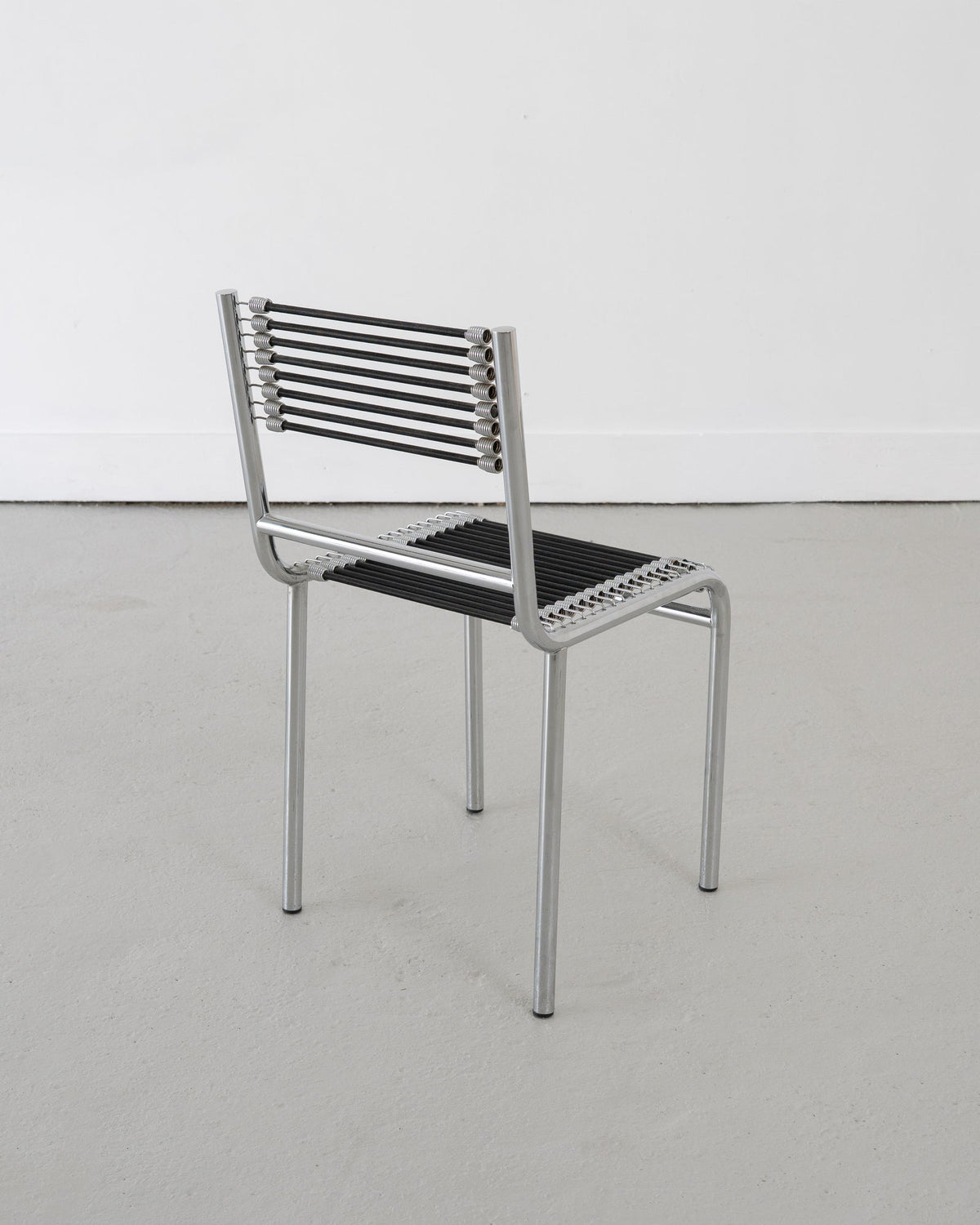 Four Sandows Chairs by René Herbst, c.1980 — side angle