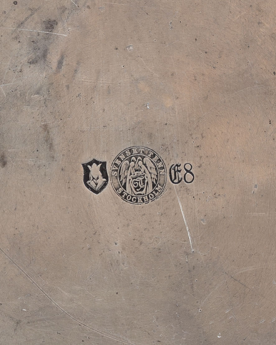 Bottom view showing maker's marks and stamps on Art Deco pewter tray