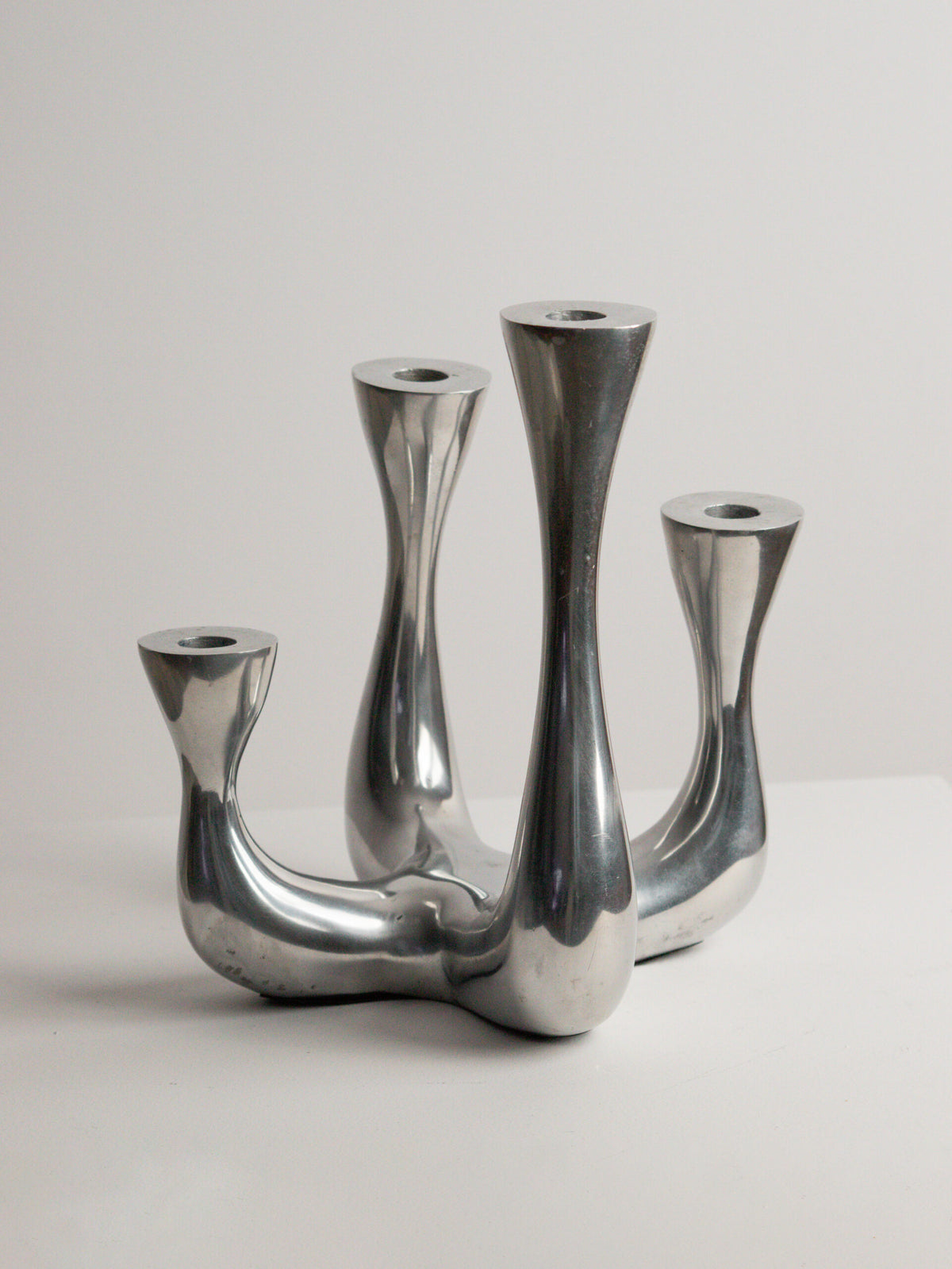 Organic Modern Four-Arm Candelabra in Polished Cast Aluminium, Swan Neck Arms, Northern European 1980s — lifestyle setting