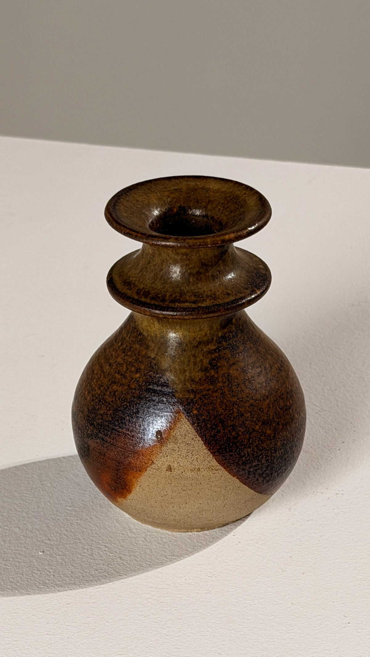 Stoneware Candleholder, France, circa 1960 — side angle showing earthy tones
