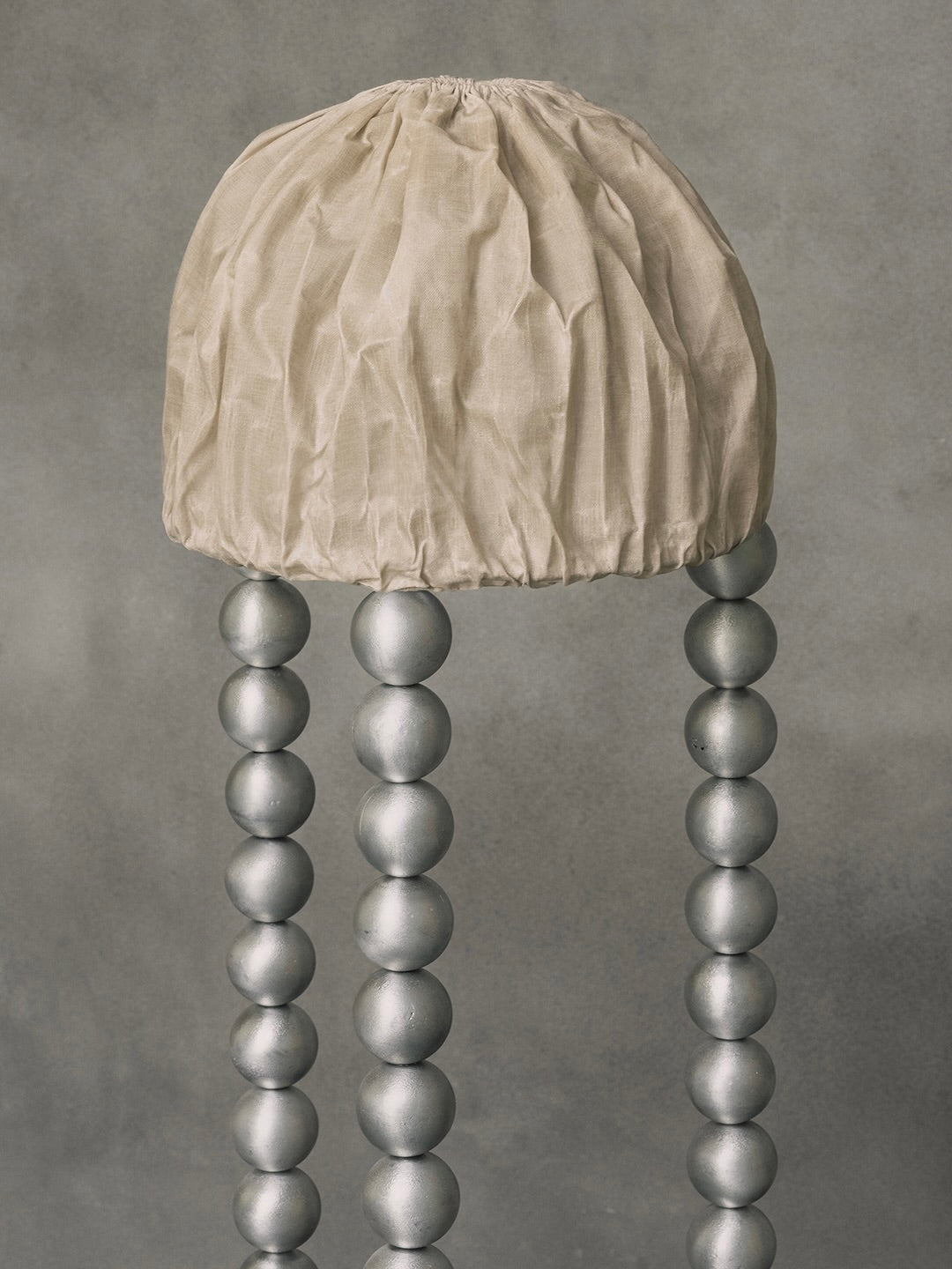 ALTER Floor Light | Aluminium Beeswax Linen — top view of linen shade and metal legs
