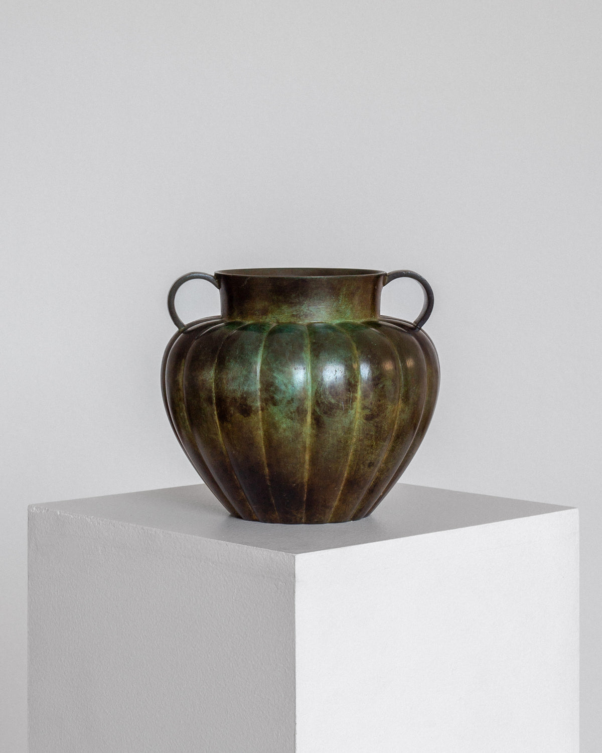 Swedish Art Deco Bronze Vase by GAB, 1930s — front view on white pedestal