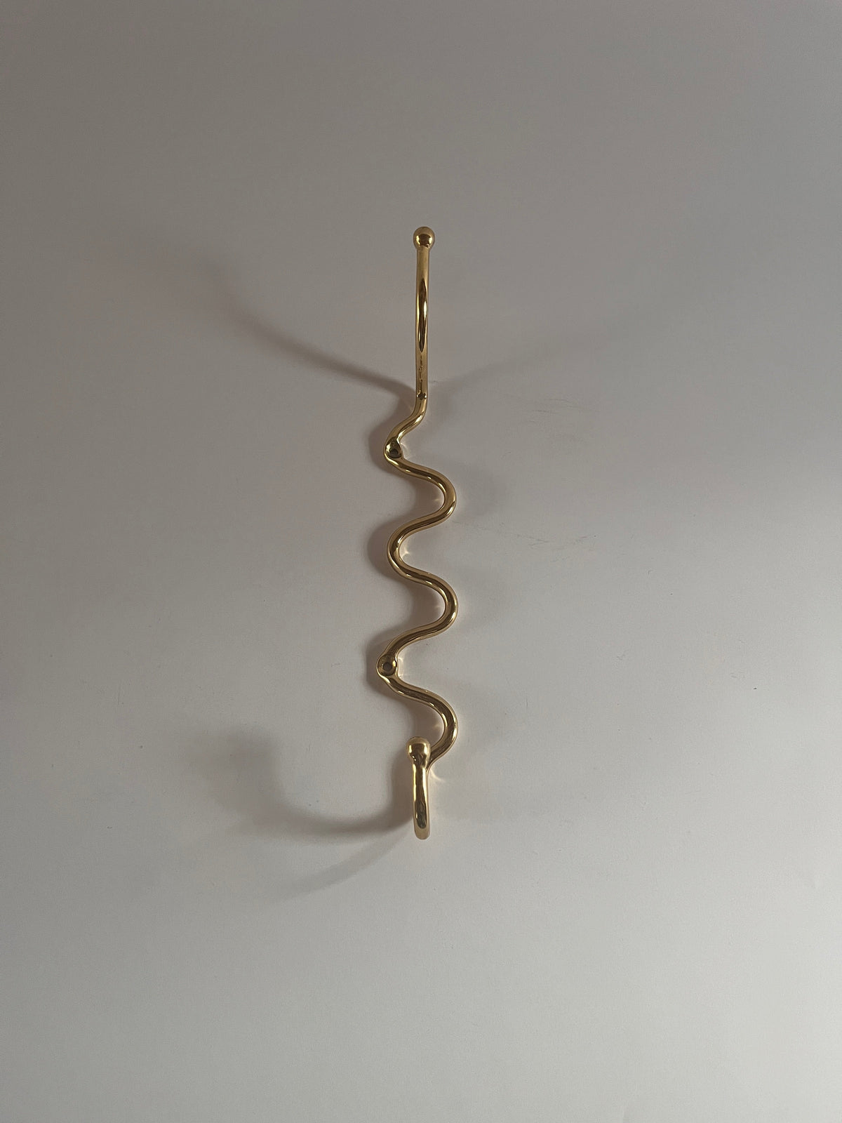 The Meander Hook by Maud Vaughan | The Oblist — gold metal finish