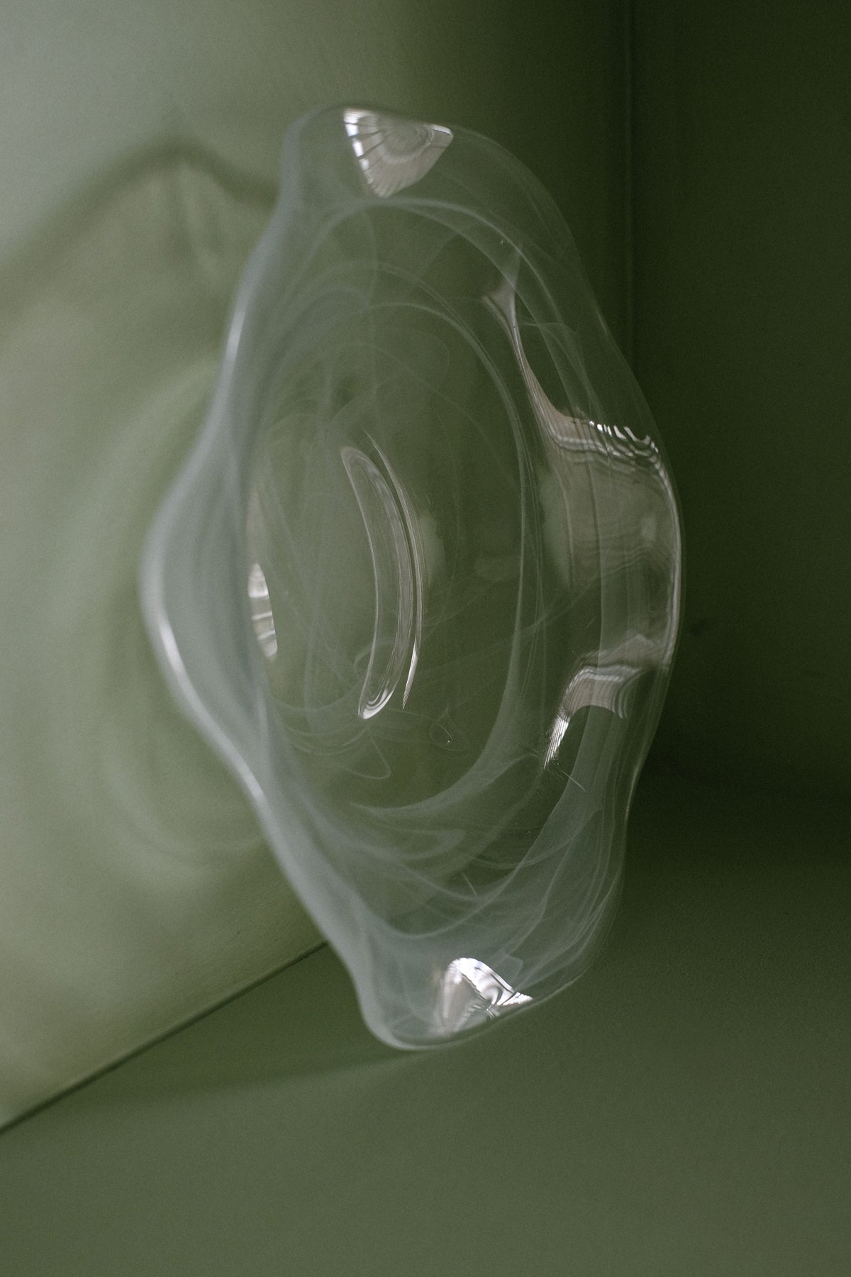 Swirl Glass Bowl — back view on green background