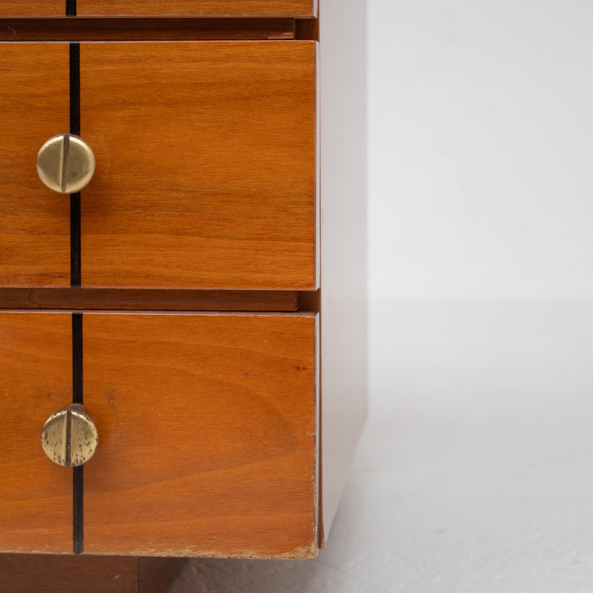 Set of Mid Century Nightstands in Wood — top view of wooden surface with brass knobs
