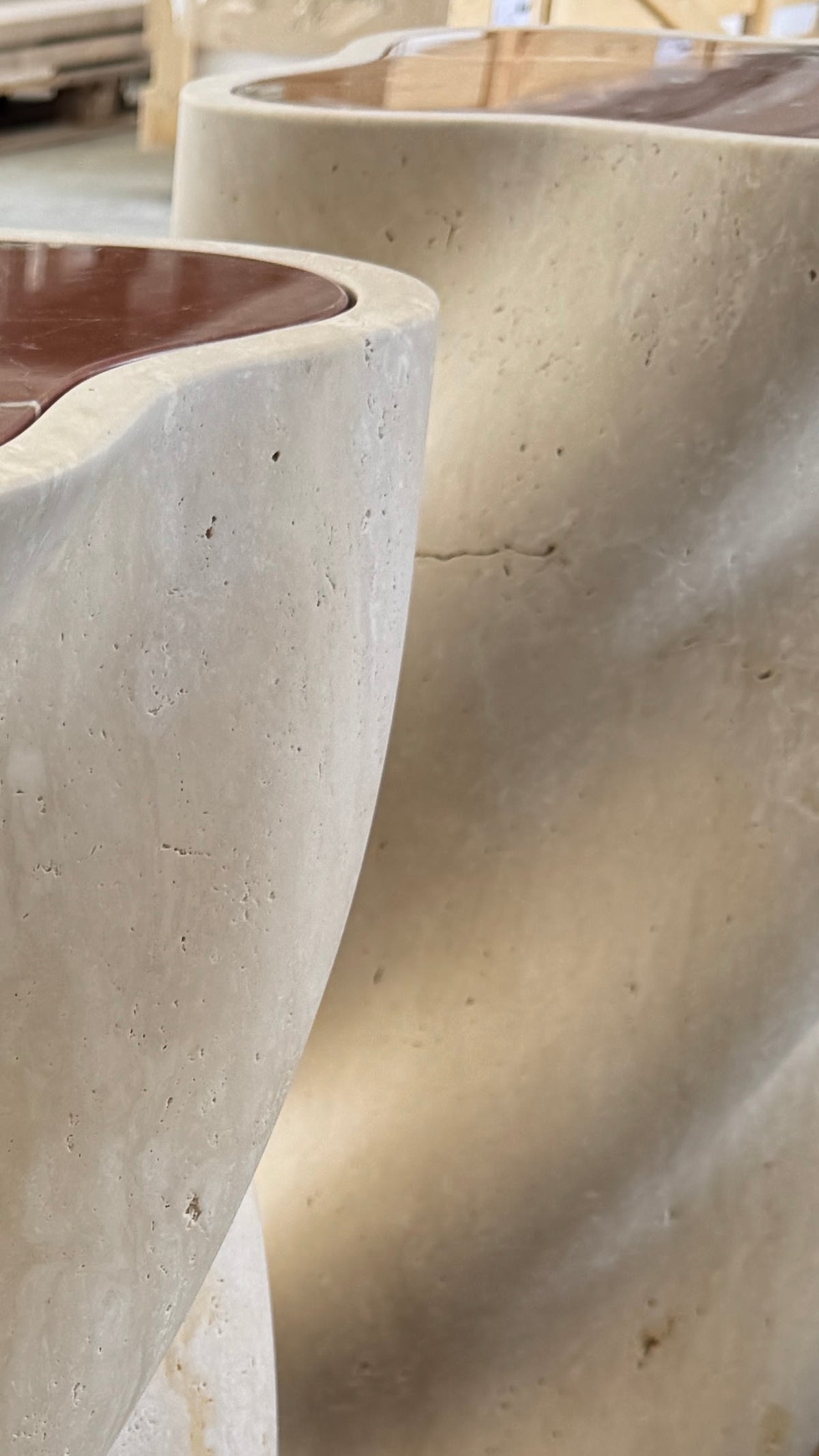 fUUUUsillo Travertine End Table — side angle highlighting smooth travertine surface