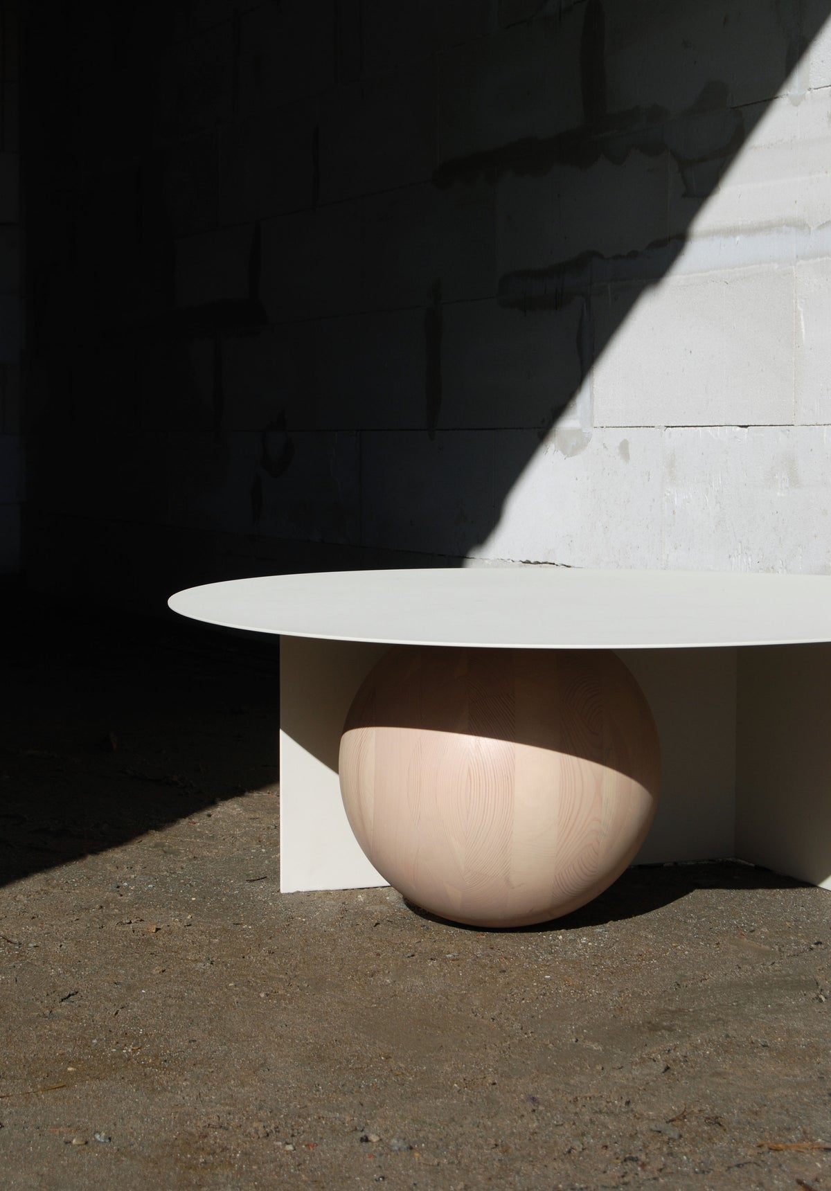 FUKU Coffee Table — side view highlighting rounded wooden base