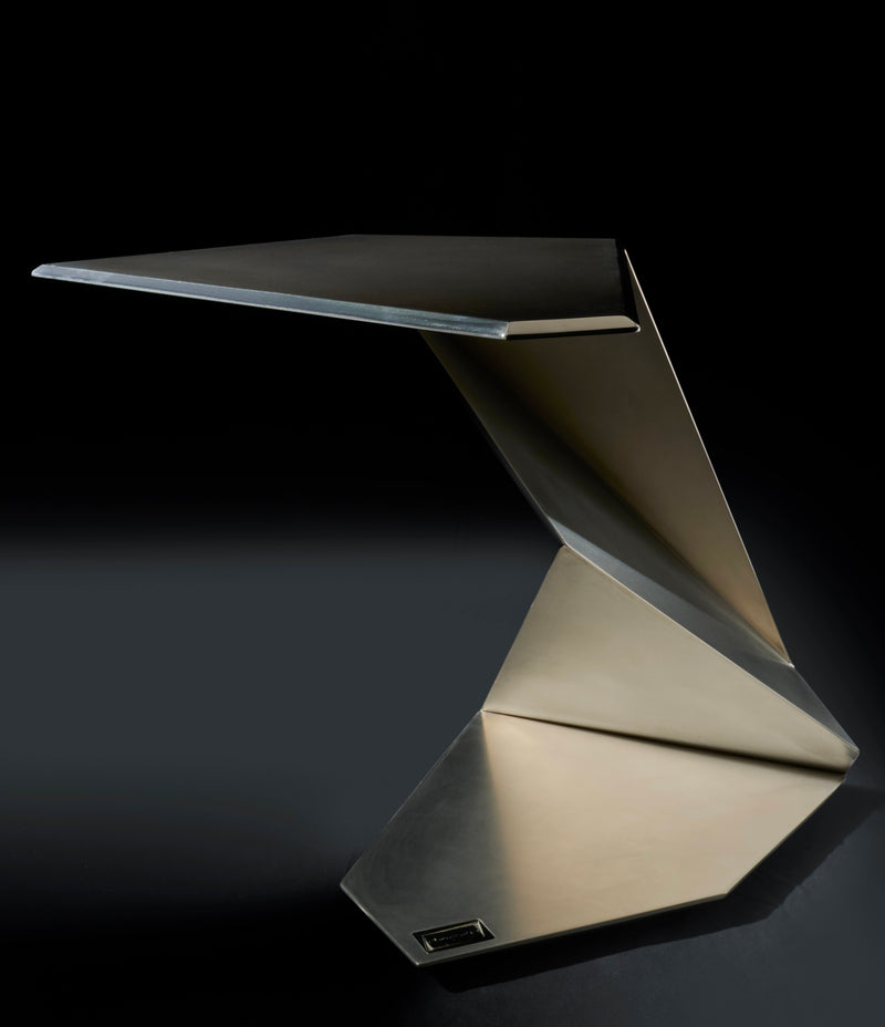 Minimalism titanium low table with origami-folded geometric base by Orfeo Studio
