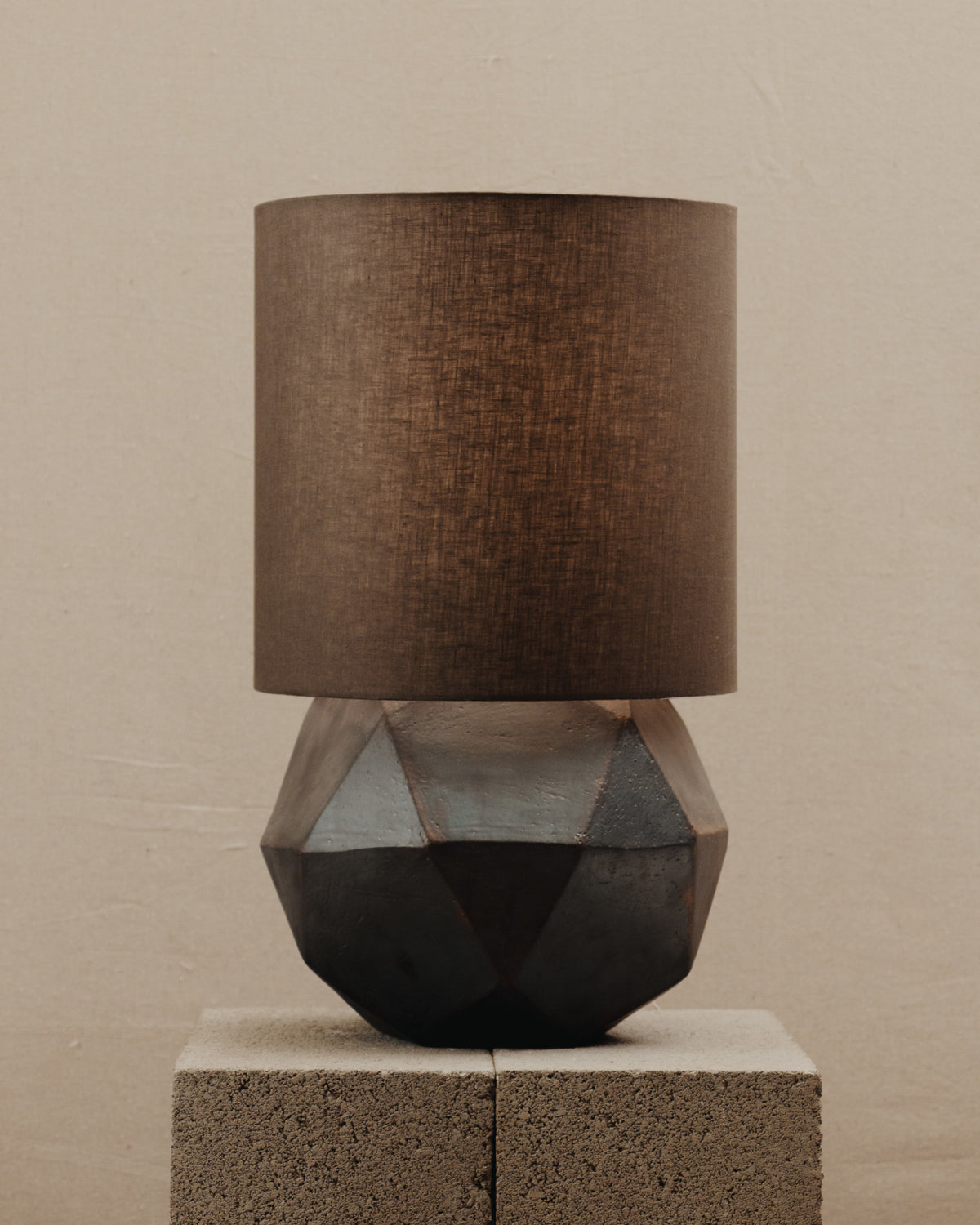 Geode Lamp — top view of geometric base with brown shade
