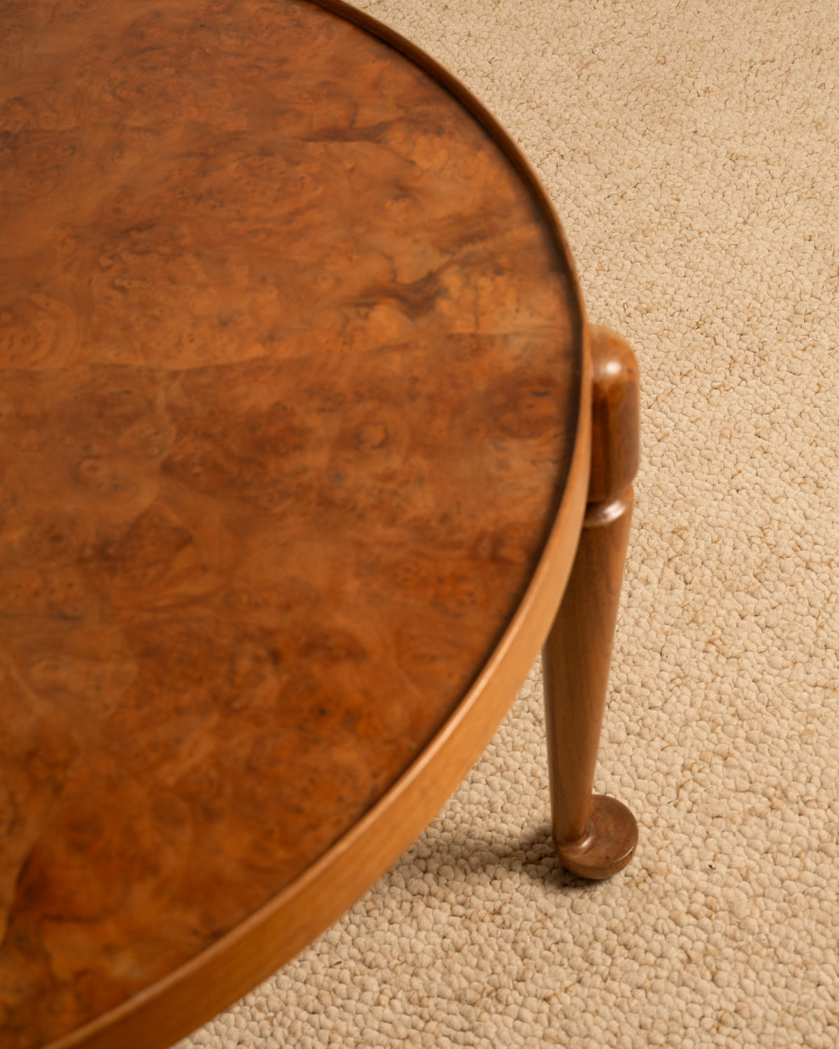 Close-up of burled wood circular side table by Josef Frank 1940s