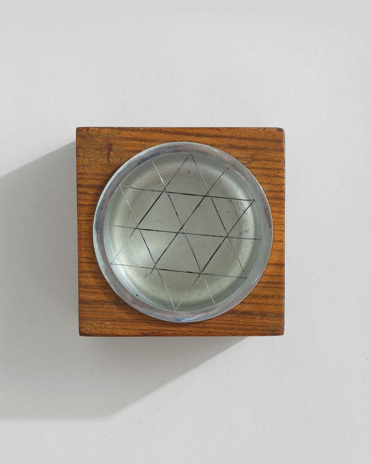 Mid-century wooden ashtray with geometric metal insert detail