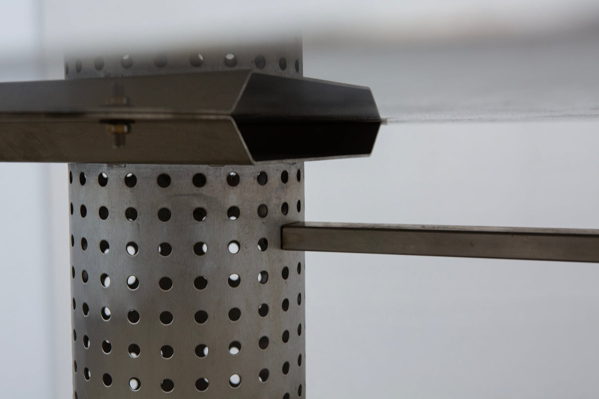 Postmodern Stainless Steel Dining Table, c.1980 — close-up of perforated metal base